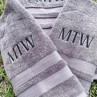 Grey towels embroidered with an MTW monogram
